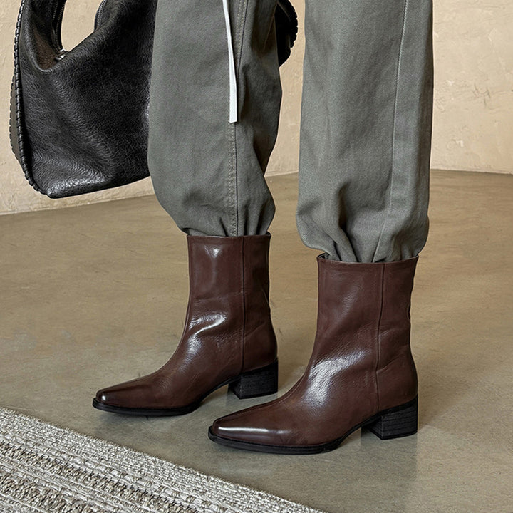 Bottes de cheville à bout pointu en cuir de mouton pour femmes en noir/marron