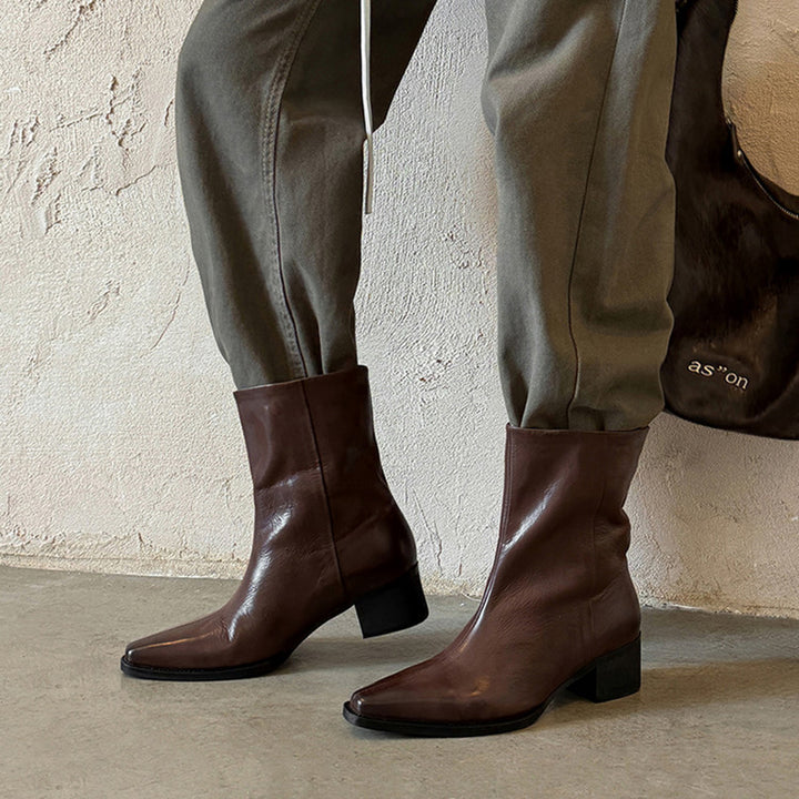 Bottes de cheville à bout pointu en cuir de mouton pour femmes en noir/marron