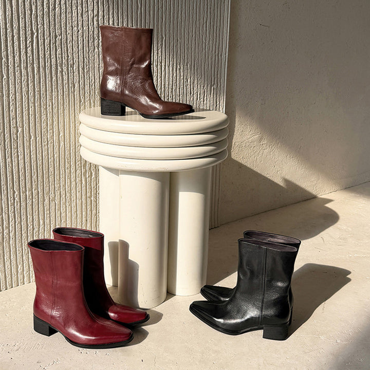 Bottes de cheville à bout pointu en cuir de mouton pour femmes en noir/marron
