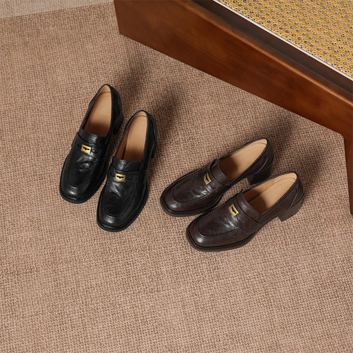 Mocassins en cuir de mouton à bout rond et talon bloc de 65 mm avec décoration en métal en marron/noir