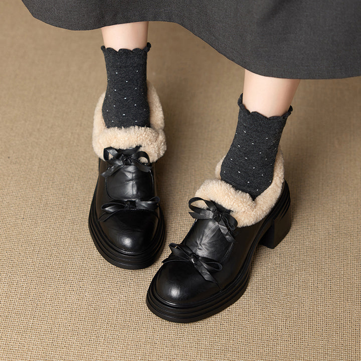 Pompes en cuir à nœud en fausse fourrure pour femmes avec talon bloc de 70 mm en noir